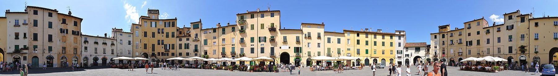 Piazza dell'Anfiteatro in Lucca, surrounded by warm-toned buildings